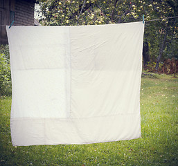 Image showing white washed duvet hanging