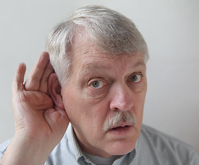 Image showing older man is hard of hearing