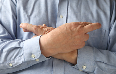 Image showing Businessman crosses his fingers and hands.  