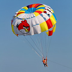 Image showing Parasailing in a blue sky.