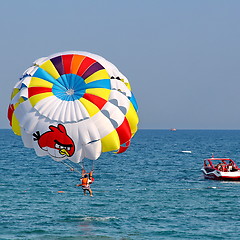 Image showing Parasailing in a blue sky.