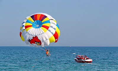 Image showing Parasailing in a blue sky.