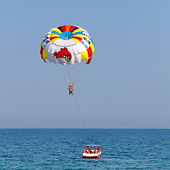 Image showing Parasailing in a blue sky.