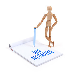 Image showing Wooden mannequin writing - HIV negative