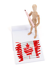 Image showing Wooden mannequin made a drawing - Canada