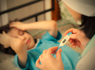 Image showing digital thermometer in the hands of a doctor. Temperature measur