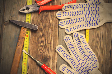 Image showing old locksmith tools, work gloves and measuring tape