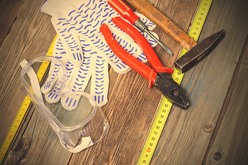 Image showing locksmith tools - old pliers, hammer, screwdriver