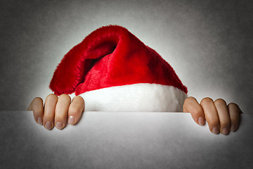 Image showing Hiding Santa woman