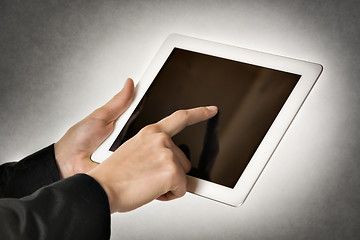 Image showing business woman points tablet computer