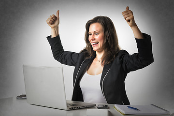 Image showing Happy woman in office with thumbs up