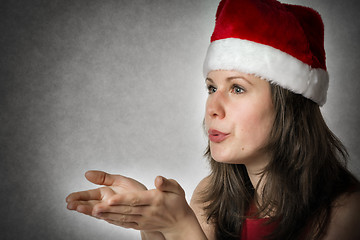 Image showing Portrait kissing Santa Woman