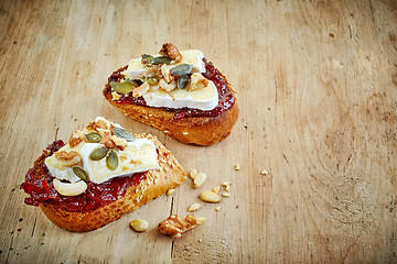 Image showing toasted bread slices with jam and brie cheese