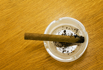 Image showing Brown cigar broken