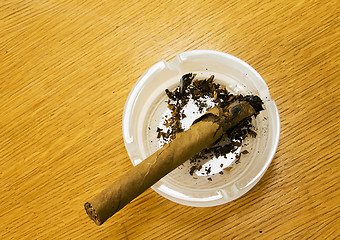 Image showing Brown cigar broken