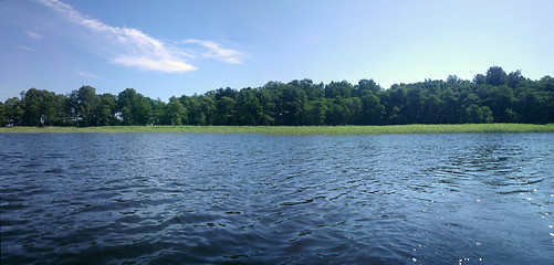 Image showing  large lake with an island and reeds