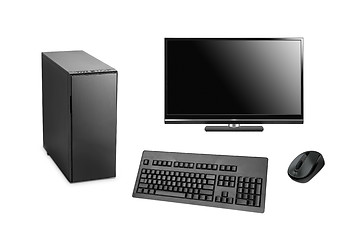 Image showing black computer with case, keyboard and mouse