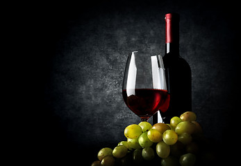 Image showing Wine with grape on black