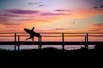 Image showing Surfer running to the beach