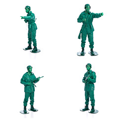 Image showing Four man on a green toy soldier costume