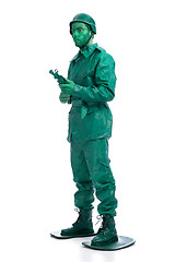 Image showing Man on a green toy soldier costume