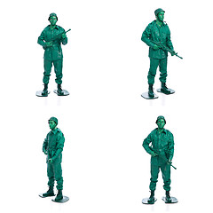 Image showing Four man on a green toy soldier costume