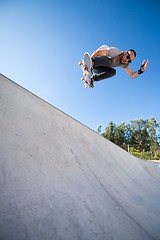 Image showing Skateboarder flying