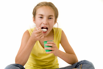 Image showing Girl eating yoghurt I