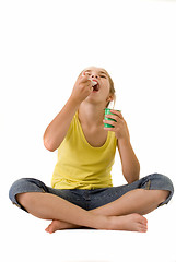 Image showing Girl eating yoghurt III