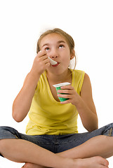 Image showing Girl eating yoghurt IV