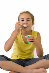 Image showing Girl eating yoghurt V