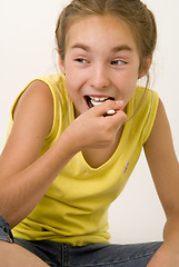 Image showing Girl eating yoghurt VI