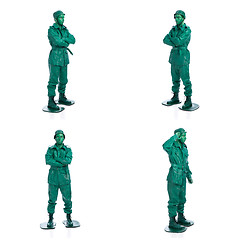 Image showing Four man on a green toy soldier costume