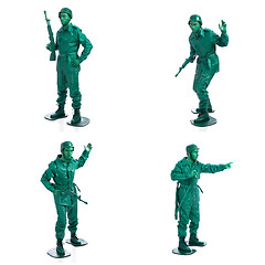 Image showing Four man on a green toy soldier costume