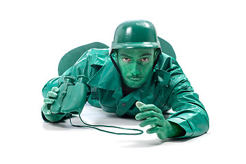 Image showing Man on a green toy soldier costume