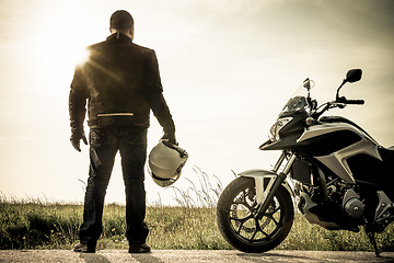 Image showing Biker on a misty sunset