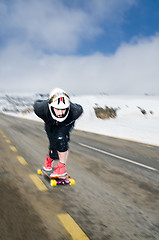 Image showing Downhill skateboarder in action