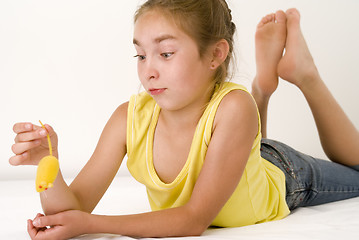 Image showing Girl with the toy mouse II