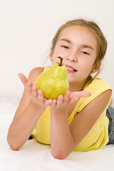 Image showing Girl with a pear I