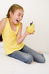 Image showing Girl with a pear III