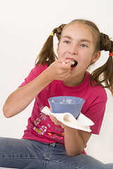 Image showing Girl eating porridge II
