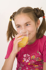 Image showing Girl drinking orange juice I