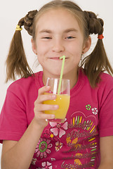 Image showing Girl drinking orange juice II