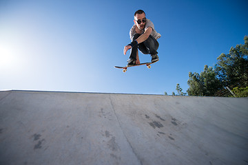 Image showing Skateboarder flying