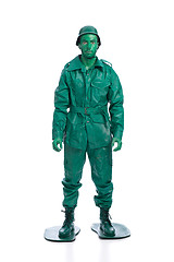 Image showing Man on a green toy soldier costume