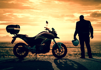 Image showing Biker on a misty sunset