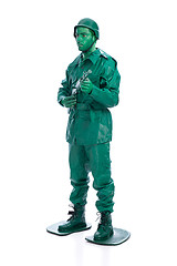 Image showing Man on a green toy soldier costume