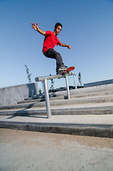 Image showing Skateboarder on rail 