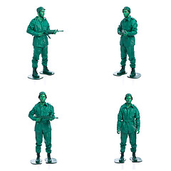 Image showing Four man on a green toy soldier costume