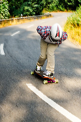 Image showing Downhill skateboarder in action